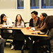 Freshmen learn from alumni and upperclassmen in a small group.